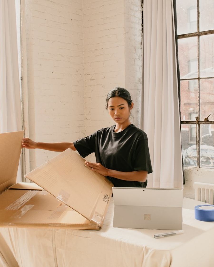 Maker packing a wholesale order into a box